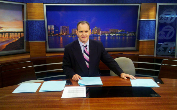 John McQuiston on the anchor desk at WWSB-TV in Sarasota, FL